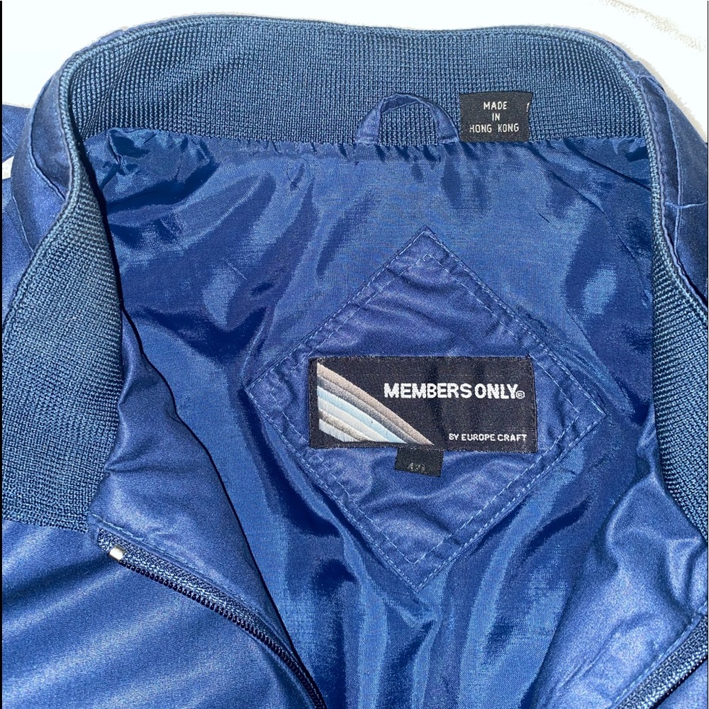 Vintage Blue/Navy Members Only Jacket with the flag. Been worn once maybe twice.